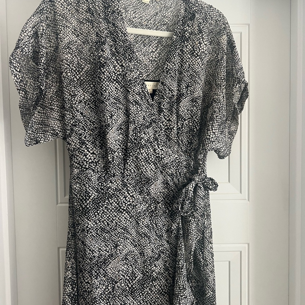 LOVESTITCH Black and White Wrap Dress with gold accents